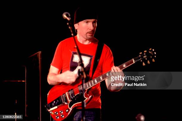 English Rock musician the Edge , of the group U2, performs onstage at the Pepsi Center, Denver, Colorado, April 8, 2001.