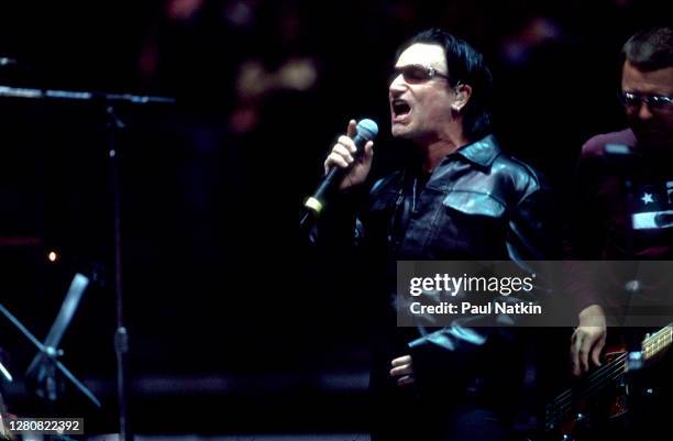 Irish Rock musician Larry Mullen Jr, of the group U2, performs onstage at the Pepsi Center, Denver, Colorado, April 8, 2001. Visible at extreme right...