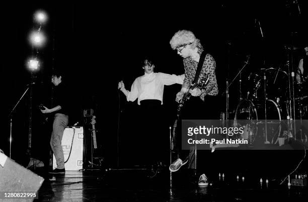 From rear left, Rock musicians the Edge (born David Evans, Bono , and Adam Clayton, all of the group U2, perform onstage at Park West, Chicago,...