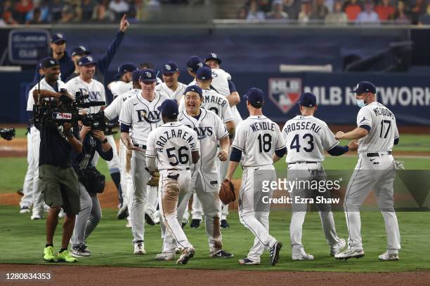 Members of the Tampa Bay Rays celebrate a 4-2 win against the Houston Astros to win the series in Game Seven of the American League Championship...