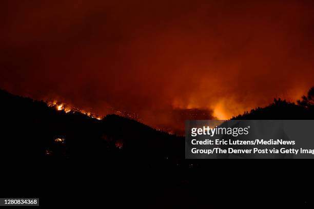 The CalWood fire burns on a hillside near Sixmile Canyon northwest of Boulder on Saturday October 17, 2020. Photo by Eric Lutzens/MediaNews Group/The...