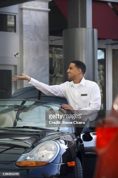 valet attendant catching keys - park service stock pictures, royalty-free photos & images