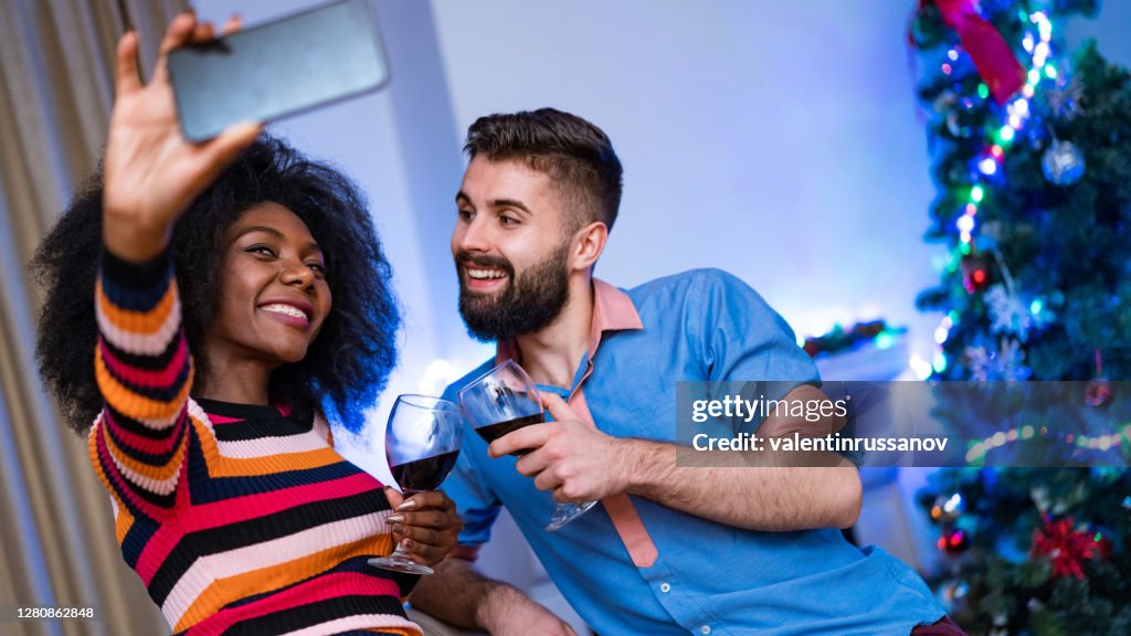 Couple taking selfie on New Year’s Eve, COVID-19 lockdown