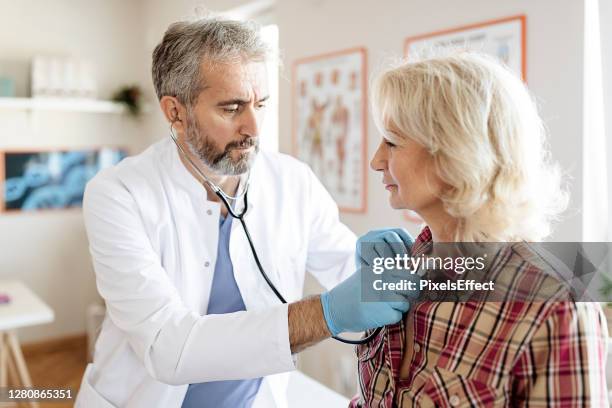 taking all precautions to make sure she is healthy - cardiologist stock pictures, royalty-free photos & images