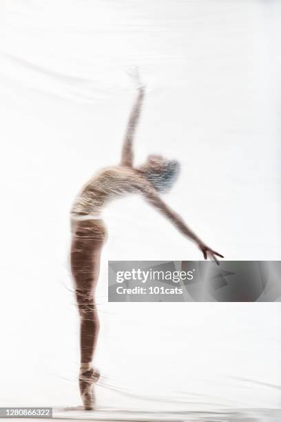 graceful ballerina dancing with transparent nylon - nylon imagens e fotografias de stock