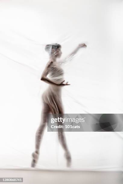 bailarina elegante bailando con nylon transparente - legs in nylon fotografías e imágenes de stock