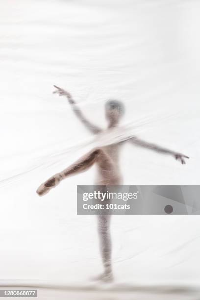 bailarina elegante bailando con nylon transparente - legs in nylon fotografías e imágenes de stock