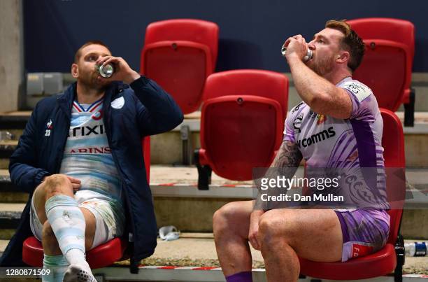 Finn Russell of Racing 92 shares a beer with Stuart Hogg of Exeter Chiefs following the Heineken Champions Cup Final between Exeter Chiefs and Racing...
