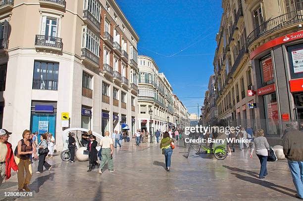 bustling commercial pedestrian street calle marques de larios, with pedicabs in foreground, malaga, costa del sol, andalucia, spain - città di málaga foto e immagini stock