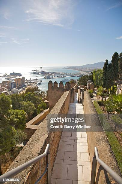 narrow walkway on the rampart and vista from castillo de gibralfaro, originally built 8th century, malaga, costa del sol, andalucia, spain - città di málaga foto e immagini stock