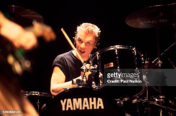 Irish Rock musician Larry Mullen Jr, of the group U2, performs onstage during the Amnesty International benefit concert at the Rosemont Horizon,...