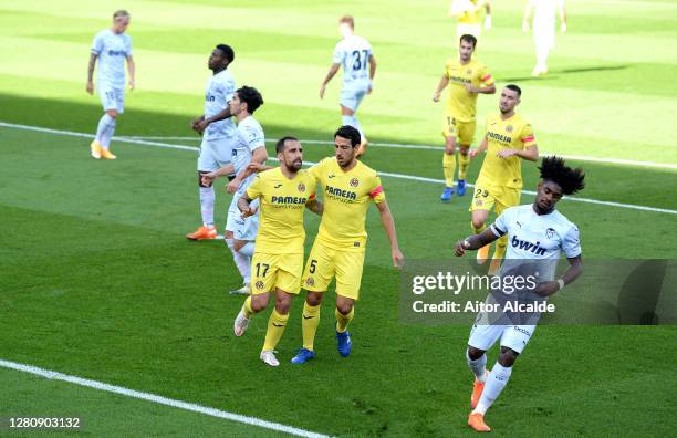 Paco Alcacer of Villarreal CF celebrates with teammate Dani Parejo after scoring his team's first goal during the La Liga Santander match between...