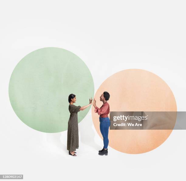 two people meeting in bubble - barrier fotografías e imágenes de stock