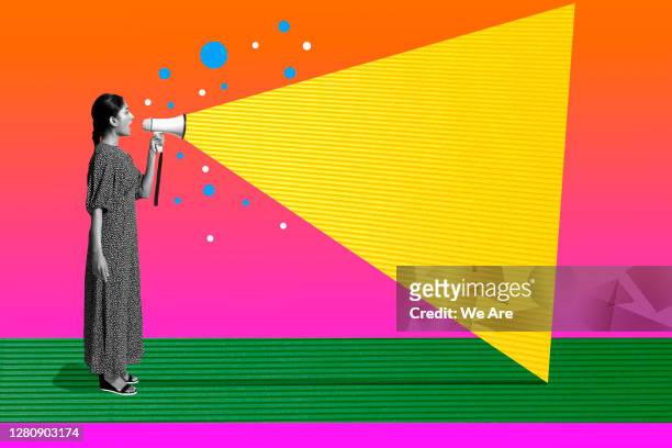 woman talking with megaphone - assertiveness stock pictures, royalty-free photos & images