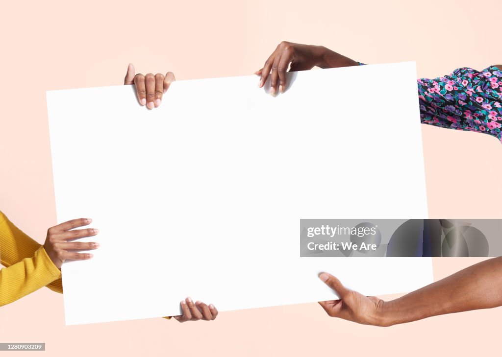 Hands holding blank sign