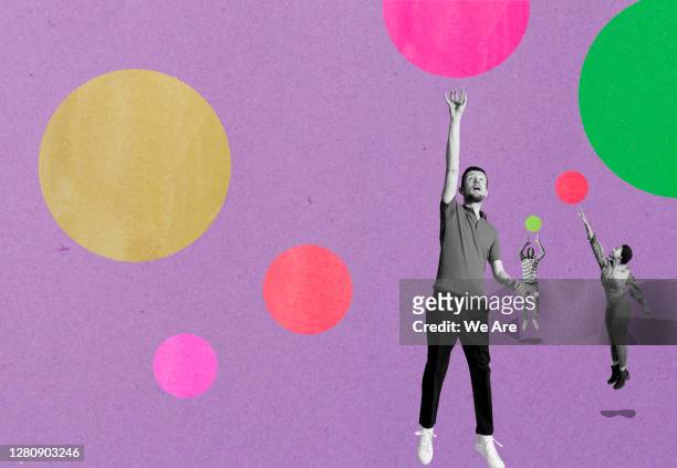 three people jumping for bubbles - erwartung stock-fotos und bilder