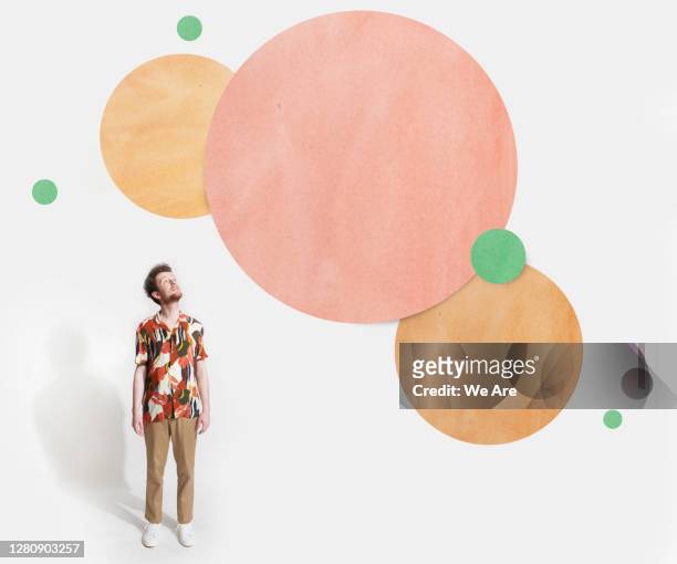 man looking up at cut out circles - reflection stock pictures, royalty-free photos & images