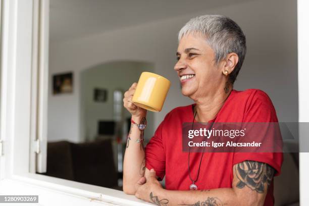coffee and enjoy the view from the window - old woman tattoos stock pictures, royalty-free photos & images