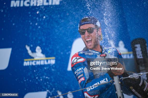 MotoGP race winner Alex Rins of Spain and Team SUZUKI ECSTAR celebrates his win with champagne at the podium during the MotoGP of Aragon at Motorland...