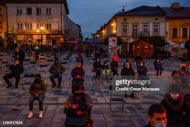 Devotees wear protective face masks and seat under social distance measures during a concert to celebrate the delayed 100th anniversary of the birth...