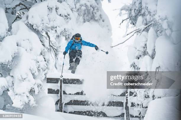 freeride skier mid air jumping over avalanche barriers, werfenweng, st johann im pongau, salzburg, austria - avalanche - fotografias e filmes do acervo