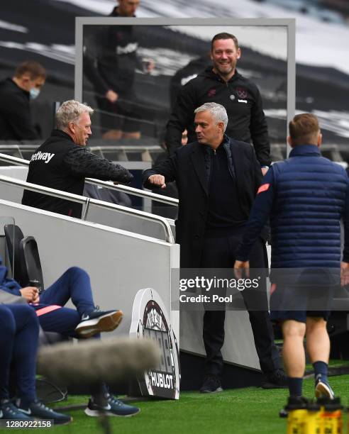 Jose Mourinho, Manager of Tottenham Hotspur greets David Moyes, Manager of West Ham United prior to the Premier League match between Tottenham...