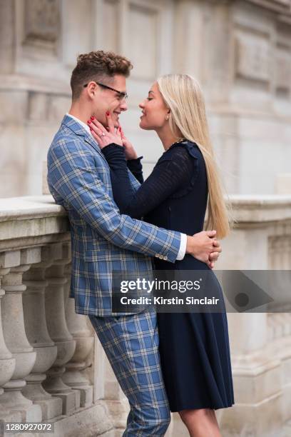 Influencer and model Angus Findlay wears a Marc Darcy suit, Ralph Lauren shirt and Dior glasses with model and Influencer Lexi Fargo wearing a Chanel...