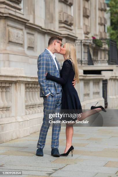 Influencer and model Angus Findlay wears a Marc Darcy suit, and waistcoat, Ralph Lauren shirt, Lasocki shoes and Dior glasses with model and...