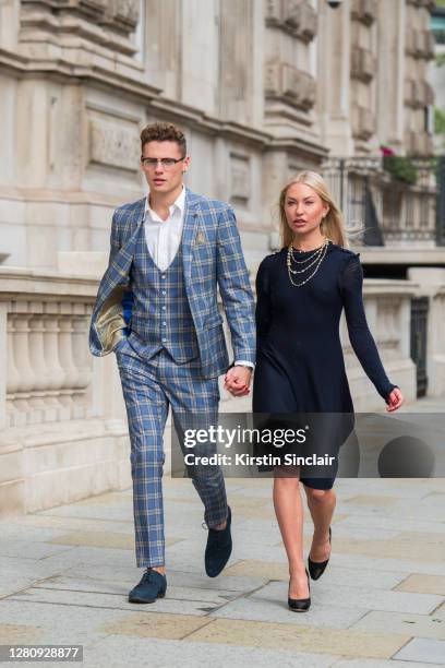 Influencer and model Angus Findlay wears a Marc Darcy suit, and waistcoat, Ralph Lauren shirt, Lasocki shoes and Dior glasses with model and...
