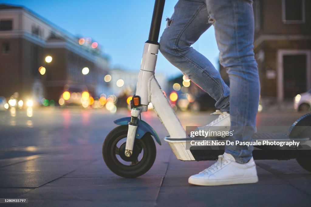 Man using electric push scooter