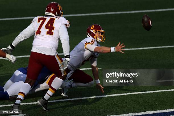 Kyle Allen of the Washington Football Team fumbles the ball to Tae Crowder of the New York Giants who returned the ball for a touchdown to take the...