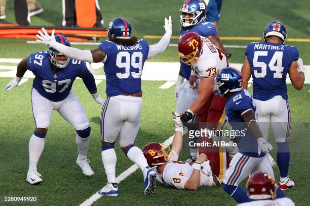 Dexter Lawrence and the New York Giants celebrate after stopping Kyle Allen of the Washington Football Team on a two point conversion attempt in the...