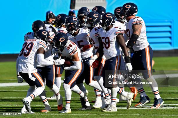 DeAndre Houston-Carson of the Chicago Bears celebrates with teammates after making an interception in the fourth quarter at Bank of America Stadium...