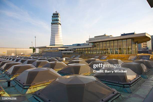 skylights on rooftop and air traffic control tower at vienna international airport, vienna, austria - flughafen wien stock-fotos und bilder