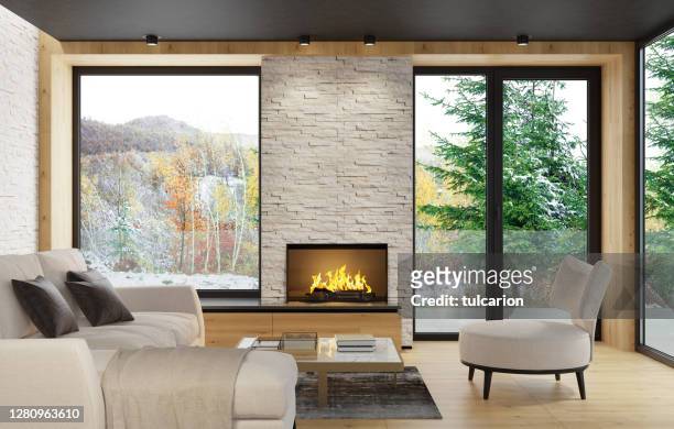 villa rural de estilo escandinavo moderno luz interior minimalista con chimenea y pared de roca pizarra blanca - insight tv fotografías e imágenes de stock