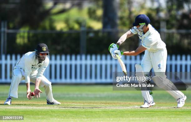 Sam Whiteman of Western Australia drops Daniel Hughes of the Blues at silly mid on during day one of the Sheffield Shield match between Western...