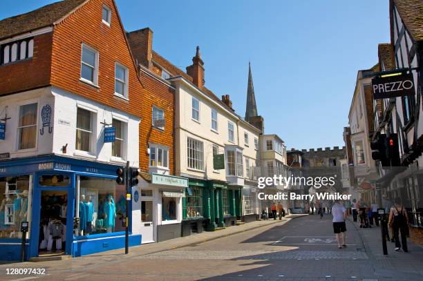 colorful shops and buildings on high street, salisbury, united kingdom - high street stock-fotos und bilder