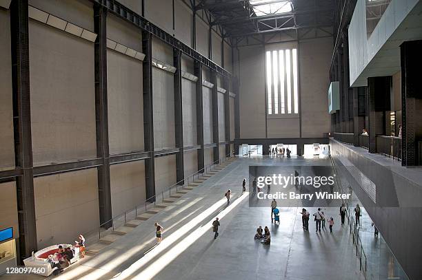 aerial view of visitors in turbine hall at tate modern, london, united kingdom - tate modern stock-fotos und bilder