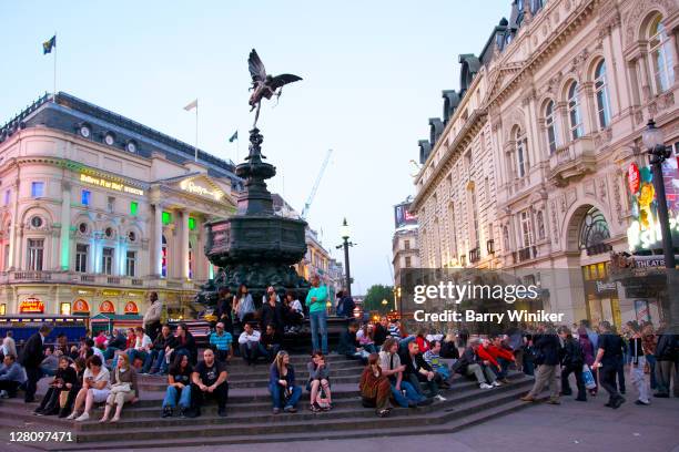 people near statue at piccadilly circus, london, united kingdom - piccadilly circus stock pictures, royalty-free photos & images