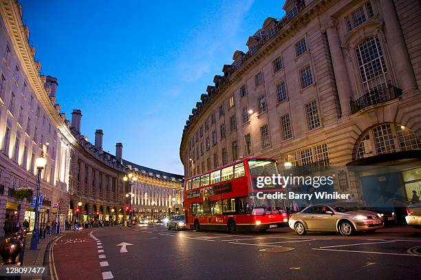 curved building line and double-decker bus on regent street near piccadilly circus, london, united kingdom - bus london fotografías e imágenes de stock