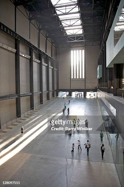 aerial view of visitors in turbine hall at tate modern, london, united kingdom - turbine hall stock pictures, royalty-free photos & images