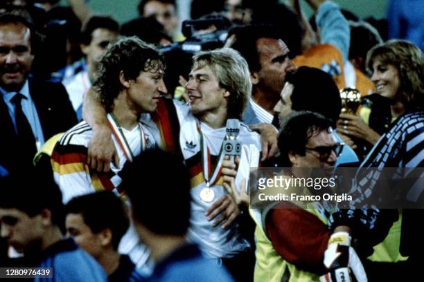 Jürgen Klinsmann of West Germany celebrates after winning the 1990 FIFA World Cup Final between West Germany and Argentina at the Olimpico Stadium on...