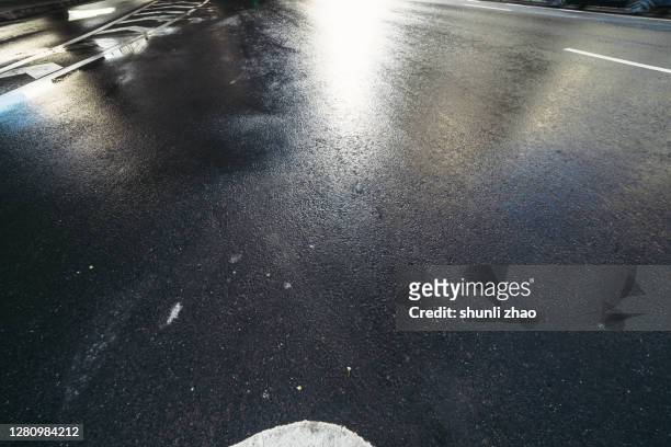 asphalt road after rain - wet road stock pictures, royalty-free photos & images