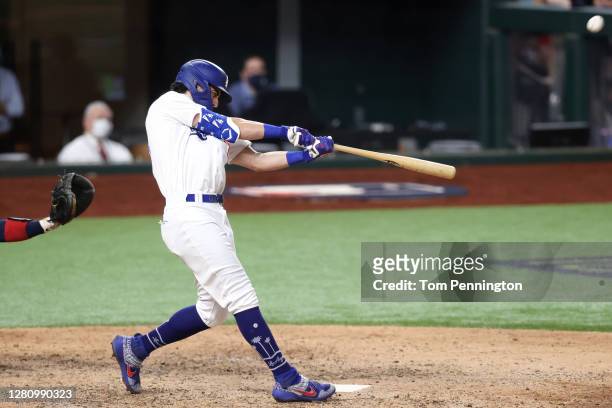 Cody Bellinger of the Los Angeles Dodgers hits a solo home run against the Atlanta Braves during the seventh inning in Game Seven of the National...