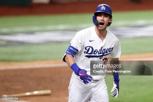 Cody Bellinger of the Los Angeles Dodgers celebrates after hitting a solo home run against the Atlanta Braves during the seventh inning in Game Seven...