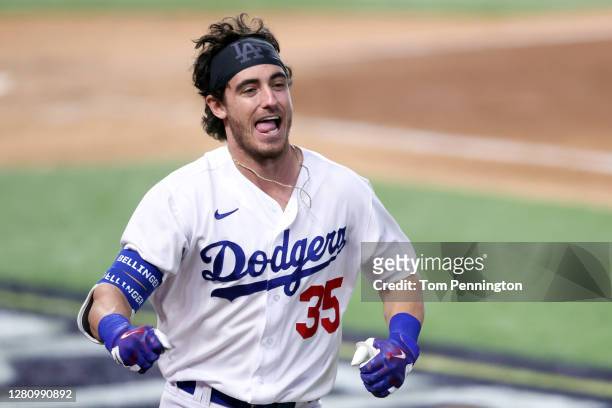 Cody Bellinger of the Los Angeles Dodgers celebrates after hitting a solo home run against the Atlanta Braves during the seventh inning in Game Seven...