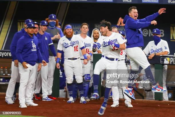 Cody Bellinger of the Los Angeles Dodgers is congratulated by his teammates after hitting a solo home run against the Atlanta Braves during the...