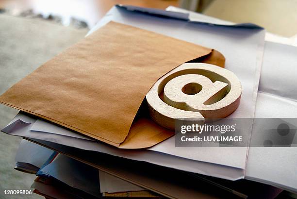 at sign sticking out of envelop - 'at' symbol stock pictures, royalty-free photos & images