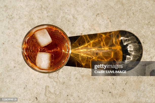 high angle view of ice tea, with two cubes of ice floating in it - ice tea stock pictures, royalty-free photos & images