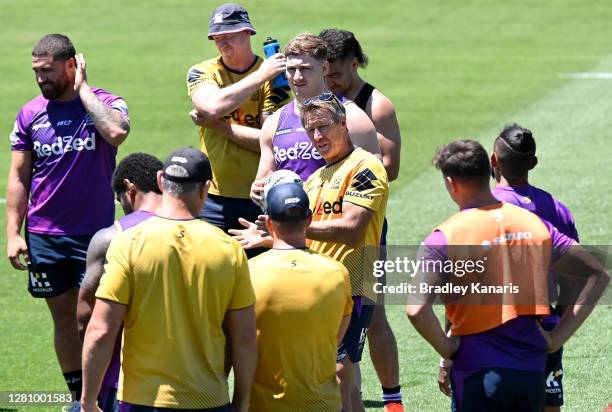 Coach Craig Bellamy talks to his players during a Melbourne Storm NRL training session at Sunshine Coast Stadium on October 19, 2020 in Sunshine...